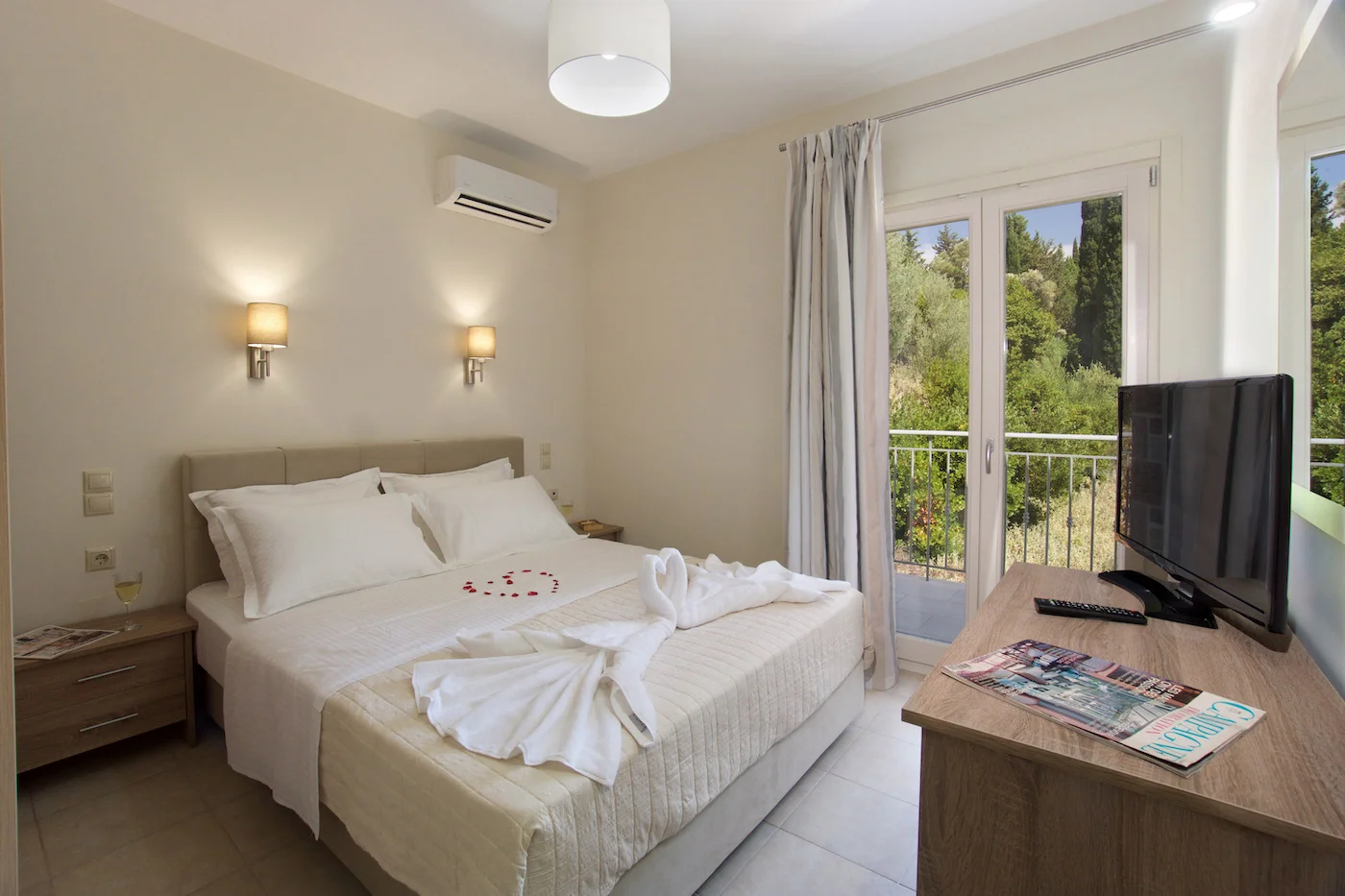 Spacious master bedroom with balcony at Villa Miranda, luxury villa